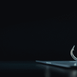 Cyberfulness phishing awareness - fishing hook emerging from smartphone screen symbolizing digital phishing scams and online security threats